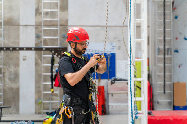 istock Male climber doing final checks before climbing 1813510729