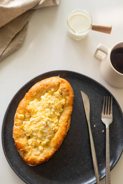 istock traditional Georgian cuisine.  Open pie with mozzarella cheese. Ajara khachapuri 1813512508