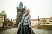 Young Beauty Woman Walking In Old Prague City at the Charles bridge
