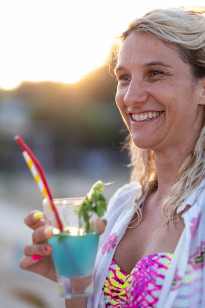 istock a woman drinks a cocktail 1813531571