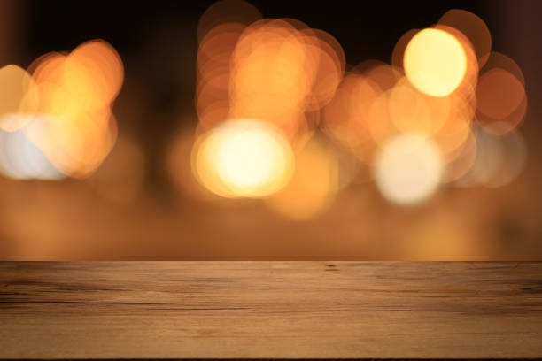 istock Beautiful empty wood table top counter, window view. Wooden table with blur bokeh background ready for product montage. Abstract blurred bokeh neutral background of city, shop, store, restaurant, city 1813577993