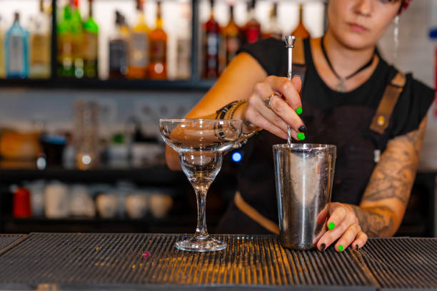 istock Professional bartender preparing a cocktail in the bar counter 1813581707