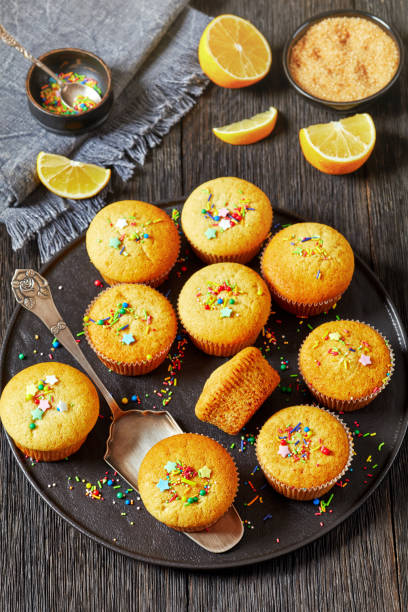 istock sweet lemon muffins on black plate, top view 1813595891