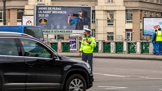 Police agent, Romanian Traffic Police (Politia Rutiera) directing traffic