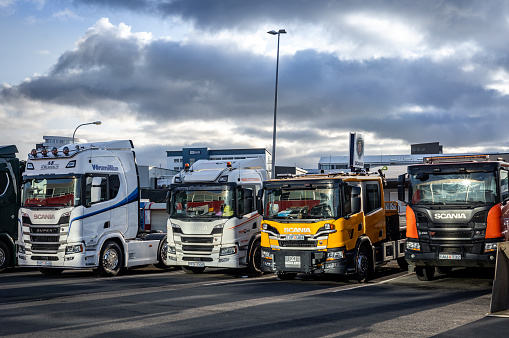 Reykjavik, Iceland - October 06, 2023: Colorful Scania trucks parked outdoors.