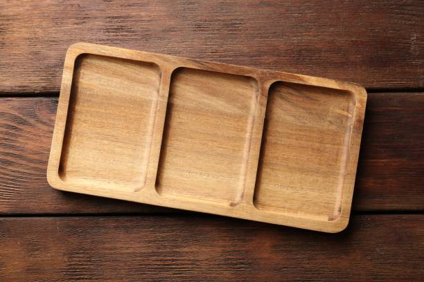 istock New compartment tray on wooden table, top view 1813639372