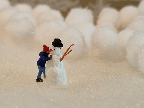 Close up of model figure and snowman