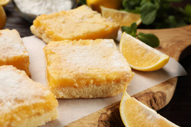 istock Tasty lemon bars with powdered sugar on table, closeup 1813641002