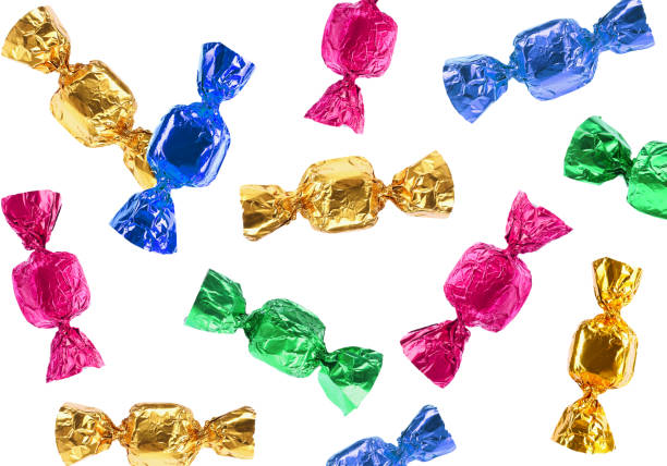 istock Tasty candies in bright wrappers falling on white background 1813641039