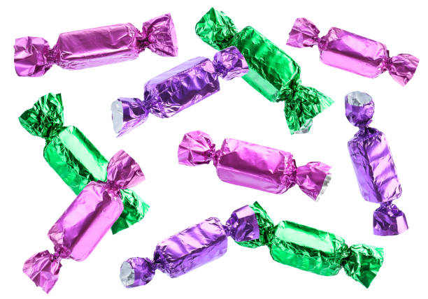 istock Tasty candies in bright wrappers falling on white background 1813641085