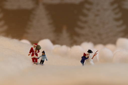 Model figure sledgers in snow