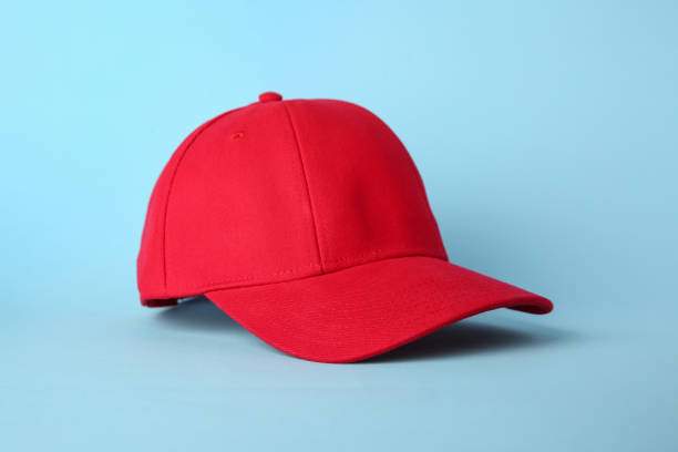 istock Stylish red baseball cap on light blue background 1813651857