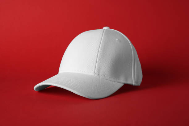 istock Stylish white baseball cap on red background 1813652383