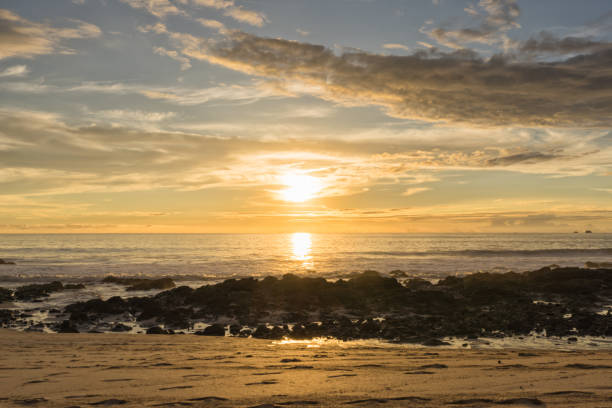 istock Golden Sunset over a Rocky Beach 1813662540