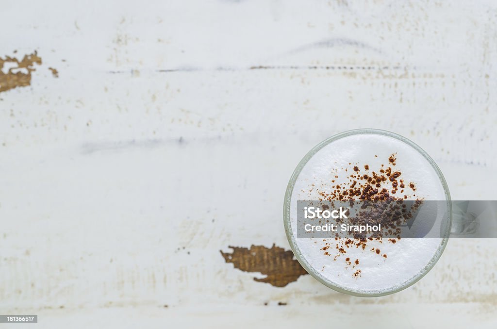 Cappuccino Cappuccino on the old vintage wood table Addiction Stock Photo