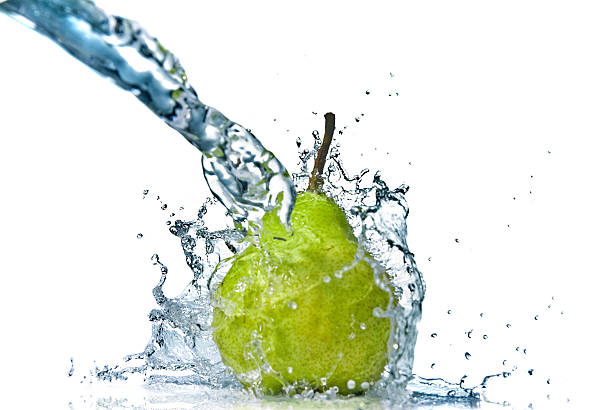 istock green pear with water splash isolated on white 181366624