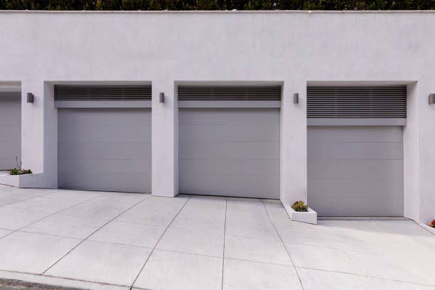 istock Three car garage painted different shades of grey. 1813716467