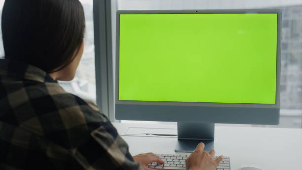 istock Copywriter texting mockup keyboard big windows room. Woman coding chromakey pc 1813723266