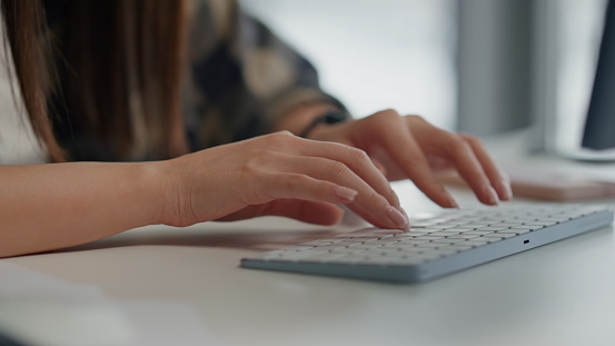 Copywriter typing keyboard text at table closeup. Programmer writing pc code