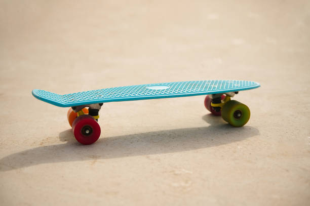 istock Still life. A blue skateboard on playground. Copy advertising space. Sport. Active lifestyle. Leisure activity. 1813764062