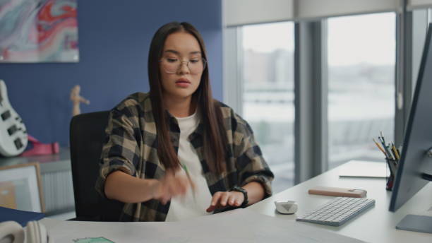 istock Angry copywriter throwing pencil table workplace. Nervous woman feeling stressed 1813771469