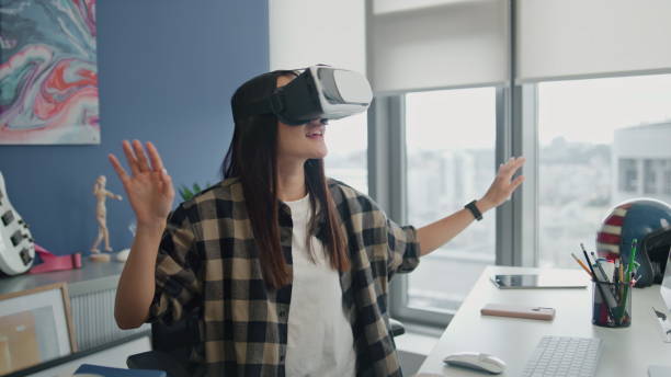 istock Excited freelancer immersing virtual reality at flat. Woman touching metaverse 1813814533