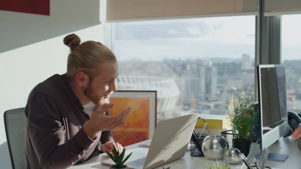 istock Two people brainstorming at office close up. Diverse colleagues discussing 1813819132