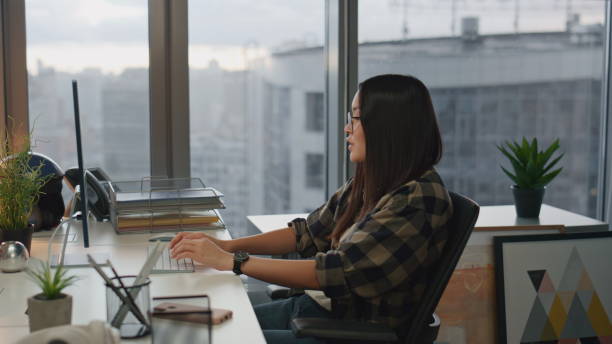 istock Positive colleagues discussing project office closeup. Team talking evening work 1813822250