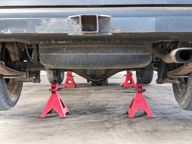 istock Jack stands hold the car for safety when changing wheels 1813833169