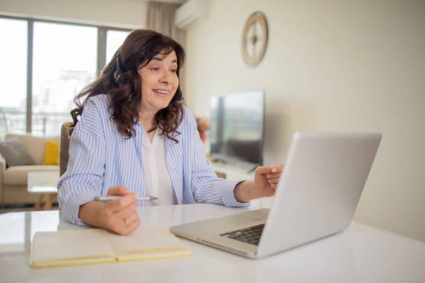 istock Mature woman working from home 1813856320