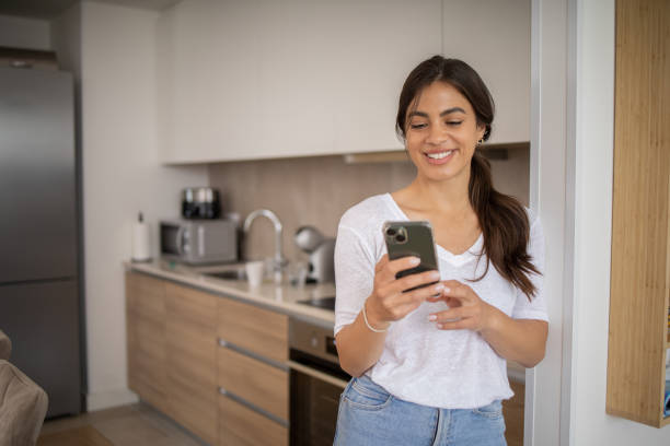 istock Happy young woman using phone 1813857386