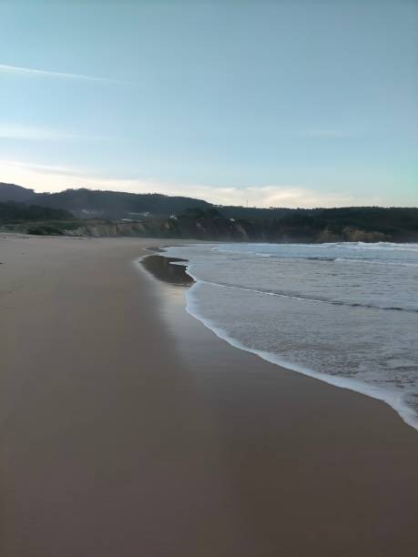 lonely beach in San Roman , Spain, in fall Lonely Horizon: Autumnal Ambiance at San Roman, Vicedo syncline stock pictures, royalty-free photos & images