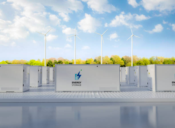 istock Energy storage systems or battery container units with turbine farm 1813860778