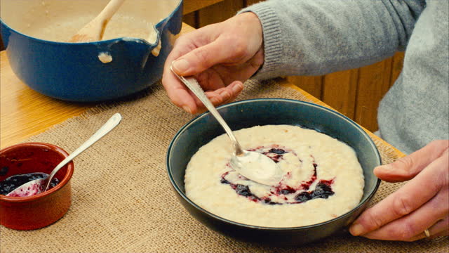 Serving and eating traditional Scottish porridge for breakfast