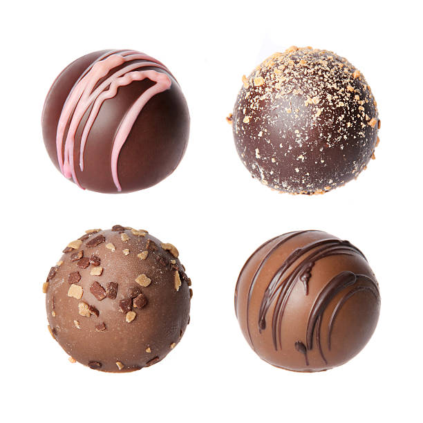 istock Chocolate candies collection. Beautiful Belgian truffles isolated 181388515