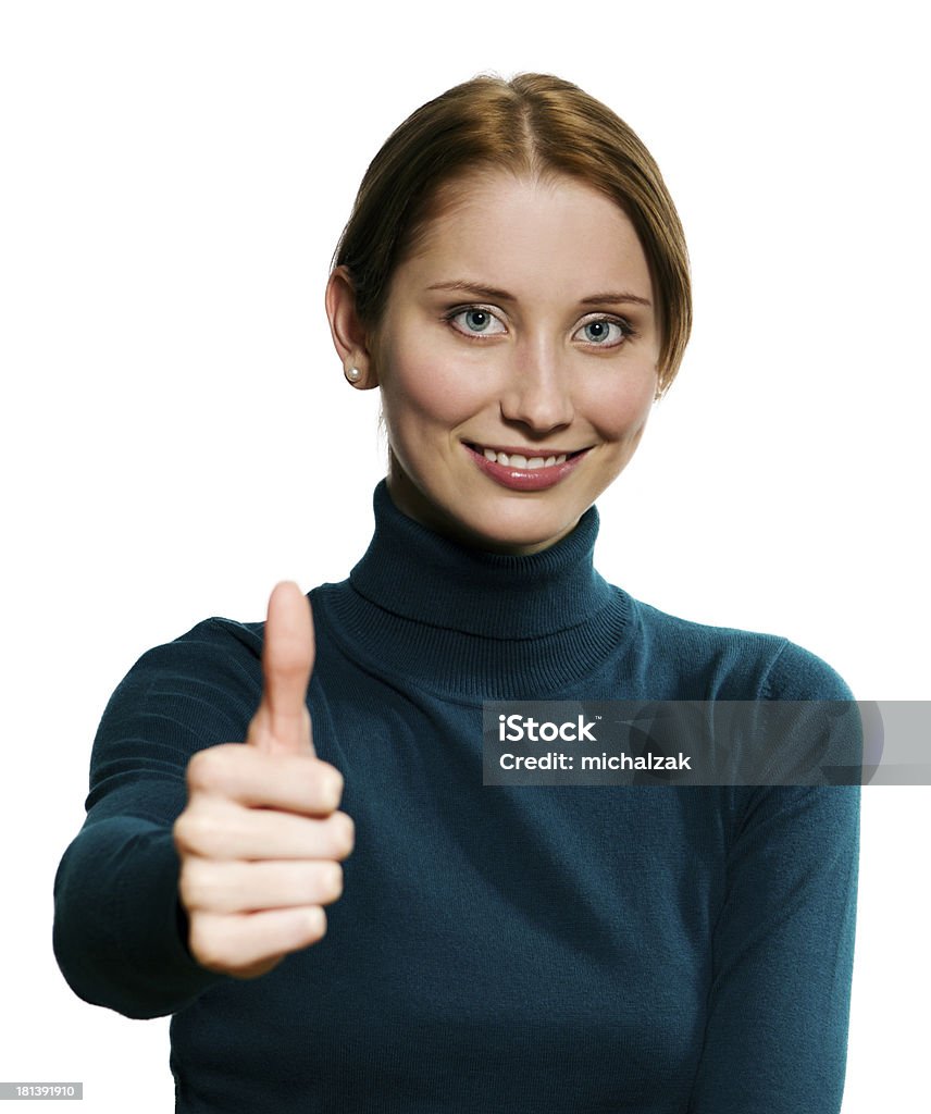 Thumbs up Close-up of a young woman showing thumbs up (focus on face) Achievement Stock Photo