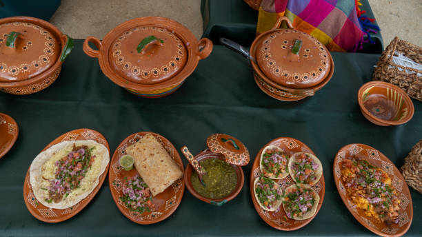 Two delicious quesadillas on black and white plates showcasing contrasting presentation styles.