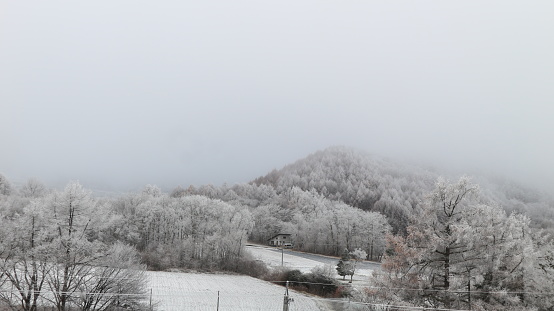 Small person in big winter landscape