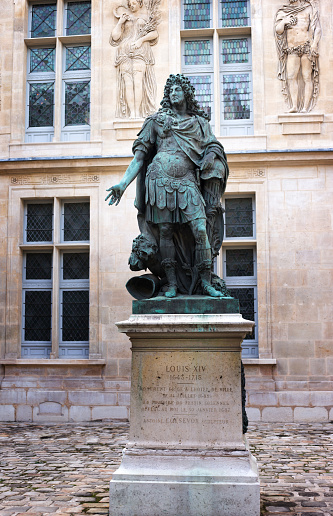 Paris, France: A statue of Louis XIV In the courtyard of Musée Carnavalet, a museum of Paris history, located in the Marais district. The building dates from the 1500s.