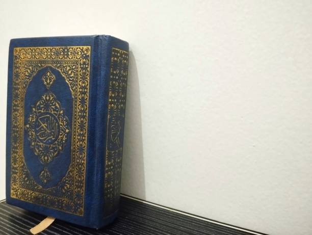 istock Al Koran on the table and empty space on a white background 1813962014