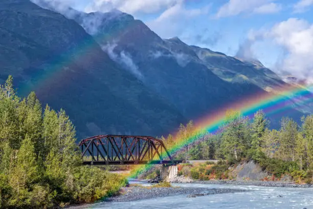 The end (or beginning) of a double rainbow on an Alaska Railroad bridge over the Placer River near Spencer Glacier in Chugach National Forest, Alaska.