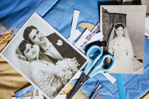 photo of clippings of old black and white photos from the 50's of wedding and family memories.concept nostalgia and past.craft concept and DIY.collage with couple antique photography.