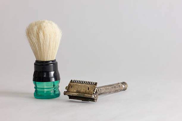 istock Safety razor isolated on a white background with brush Macro 181399911