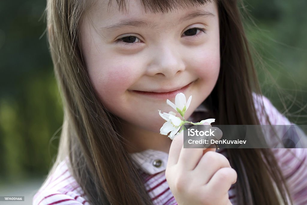 Portrait of girl Portrait of beautiful young girl with flowers in the park Child Stock Photo