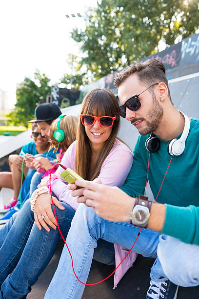 istock Young couple at the skatepark 181400603