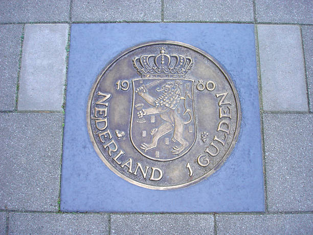 istock coin of one guilder in pavement 181400631