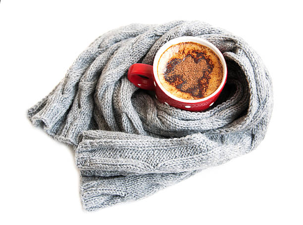 istock Cup of cocoa wrapped in grey scarf 181401107