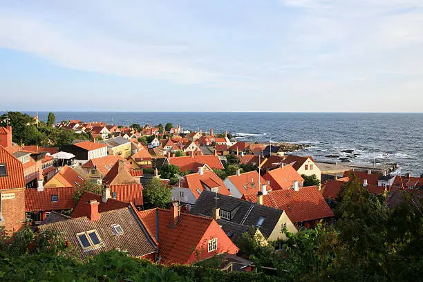 Storm on the sea, picturesque small town Gudhjem by early morning, Bornholm Island, Denmark