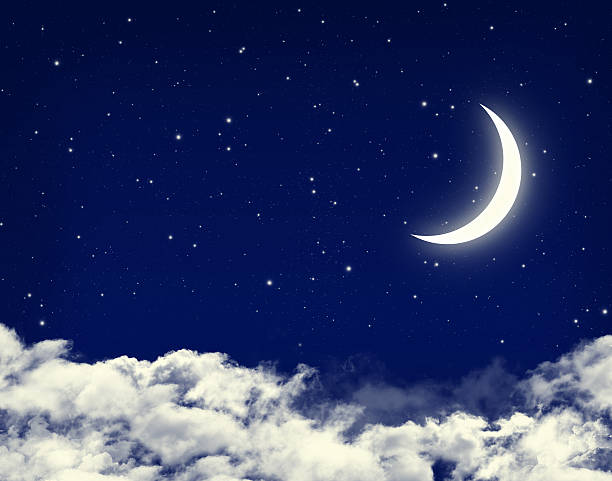 istock Moon and stars in a cloudy night blue sky 181401984