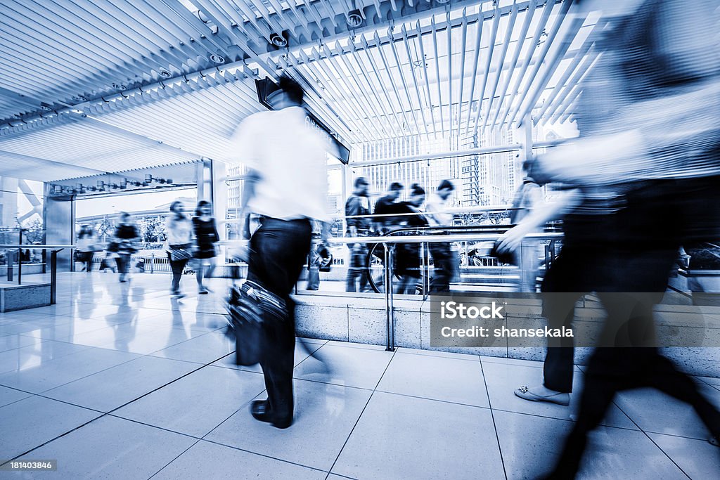 business traveller business traveller walking  through the walkway in shanghai airport. Adult Stock Photo